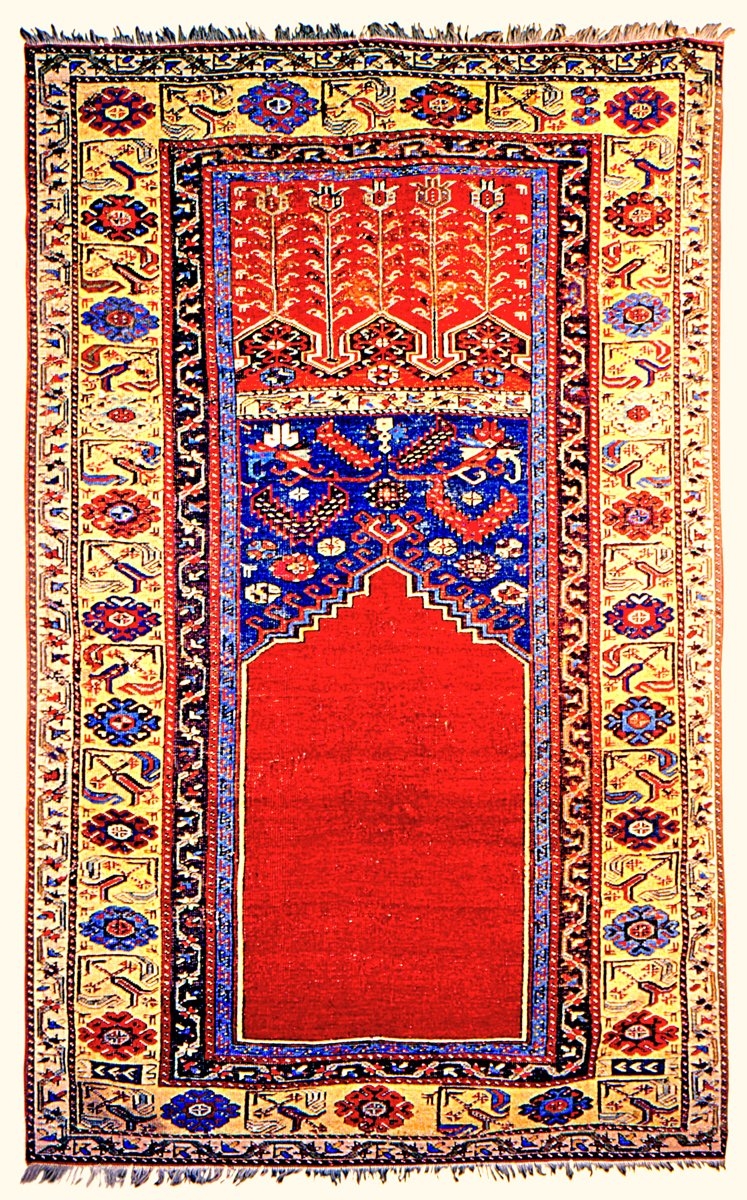 XIX. yüzyılın ilk yarısına ait bir Lâdik halı-seccadesi (Barbican Art Gallery)