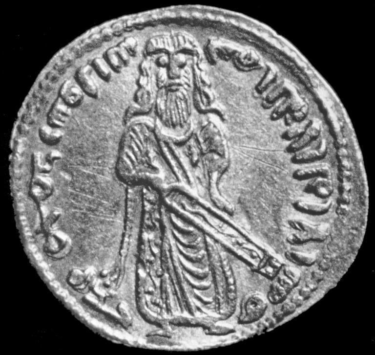 Ön yüzünde Halife Abdülmelik’in tasviri ve bazı dinî ibareler bulunan bir dinar (Sourdel, lv. 23)